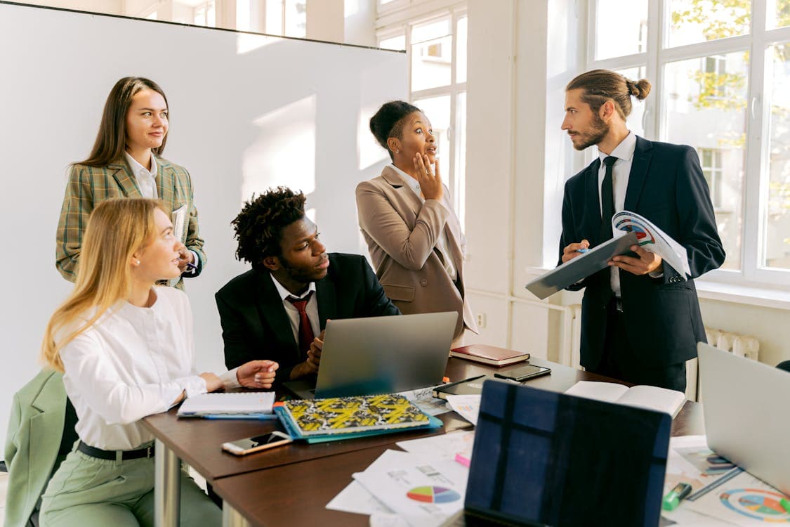 Office team discussing strategy at a table